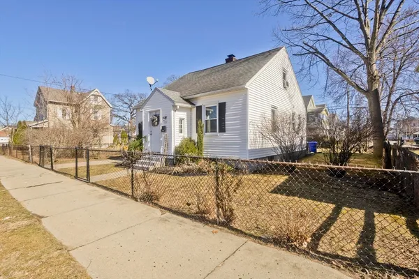 a view of a house with snow on the road