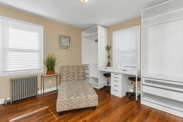 a bedroom with furniture and a window