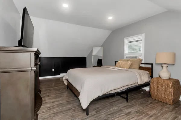 a living room with a flat screen tv and a fireplace