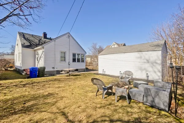 a view of swimming pool with outdoor seating