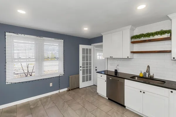 a kitchen with a sink and cabinets