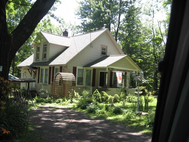 65 Reeder Street Mount Pocono, PA 18344 - Photo 8 of 9 a front view of a house with a yard