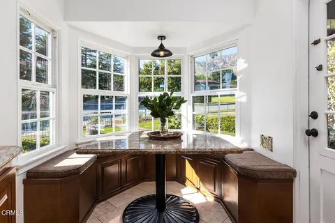 a large bed sitting in a bedroom next to a window