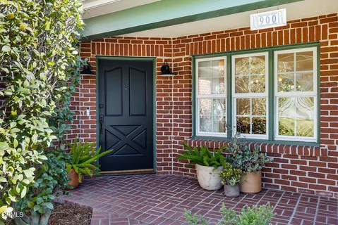 a living room with furniture rug and a window