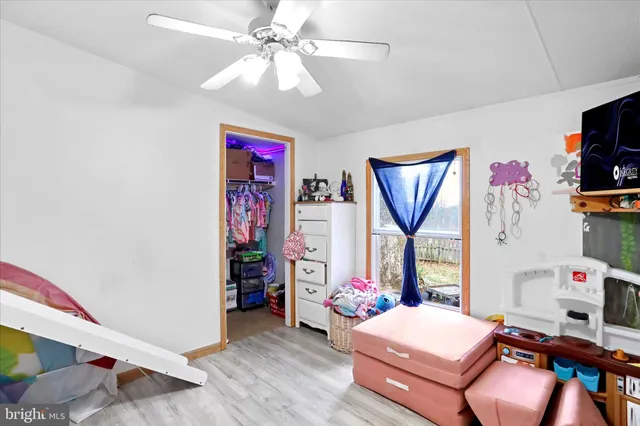 a bedroom with furniture and a bed