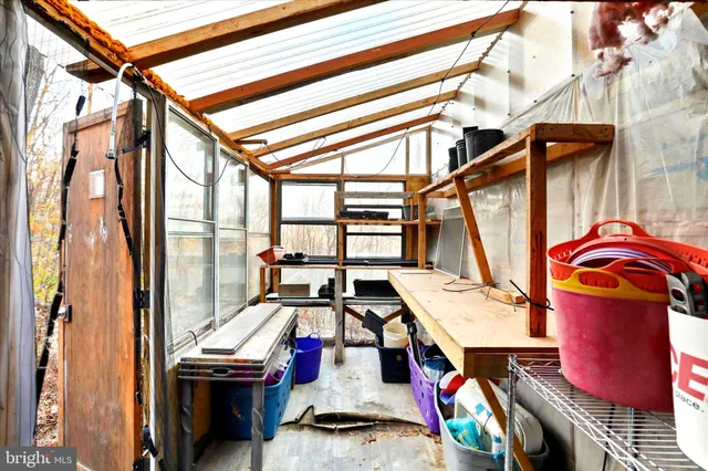 a view of living room with furniture and wooden floor