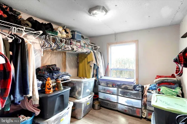 a bath room with a window and a table
