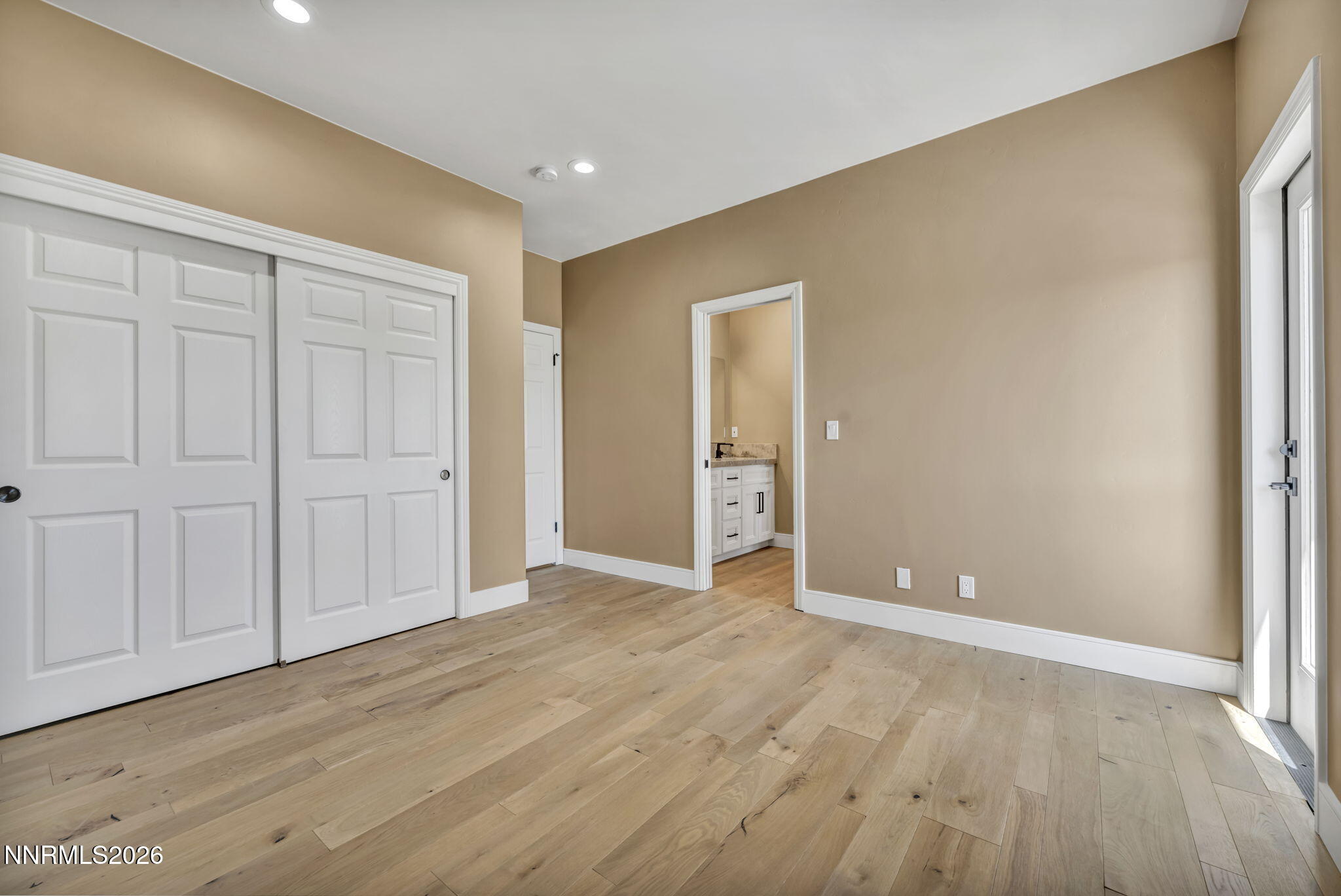2965 Roundrock Court Reno, NV 89511 - Photo 29 of 40 a view of an empty room with wooden floor