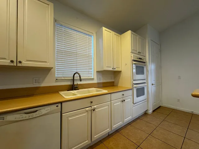 a view of a kitchen with electric appliances