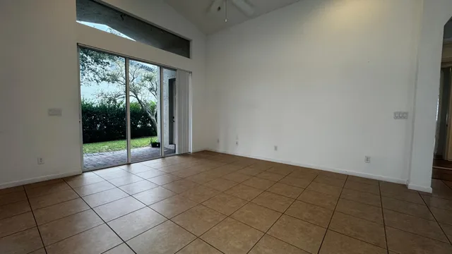 a view of an empty room with windows