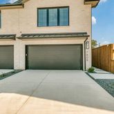 a front view of a house with garage
