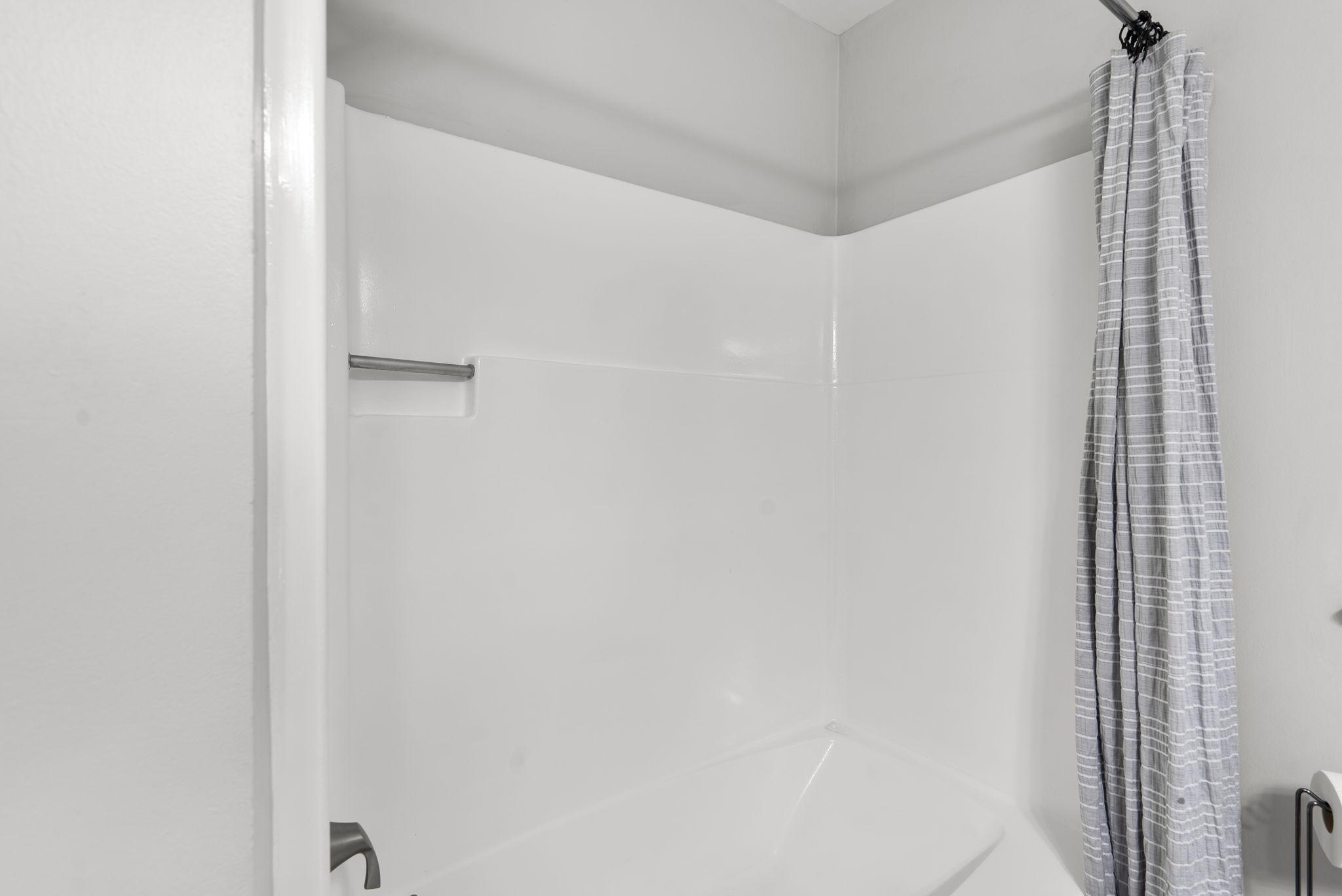 12410 Piedmont Road Clarksburg, MD 20871 - Photo 36 of 64 Hall bathroom shower space with sleek design.