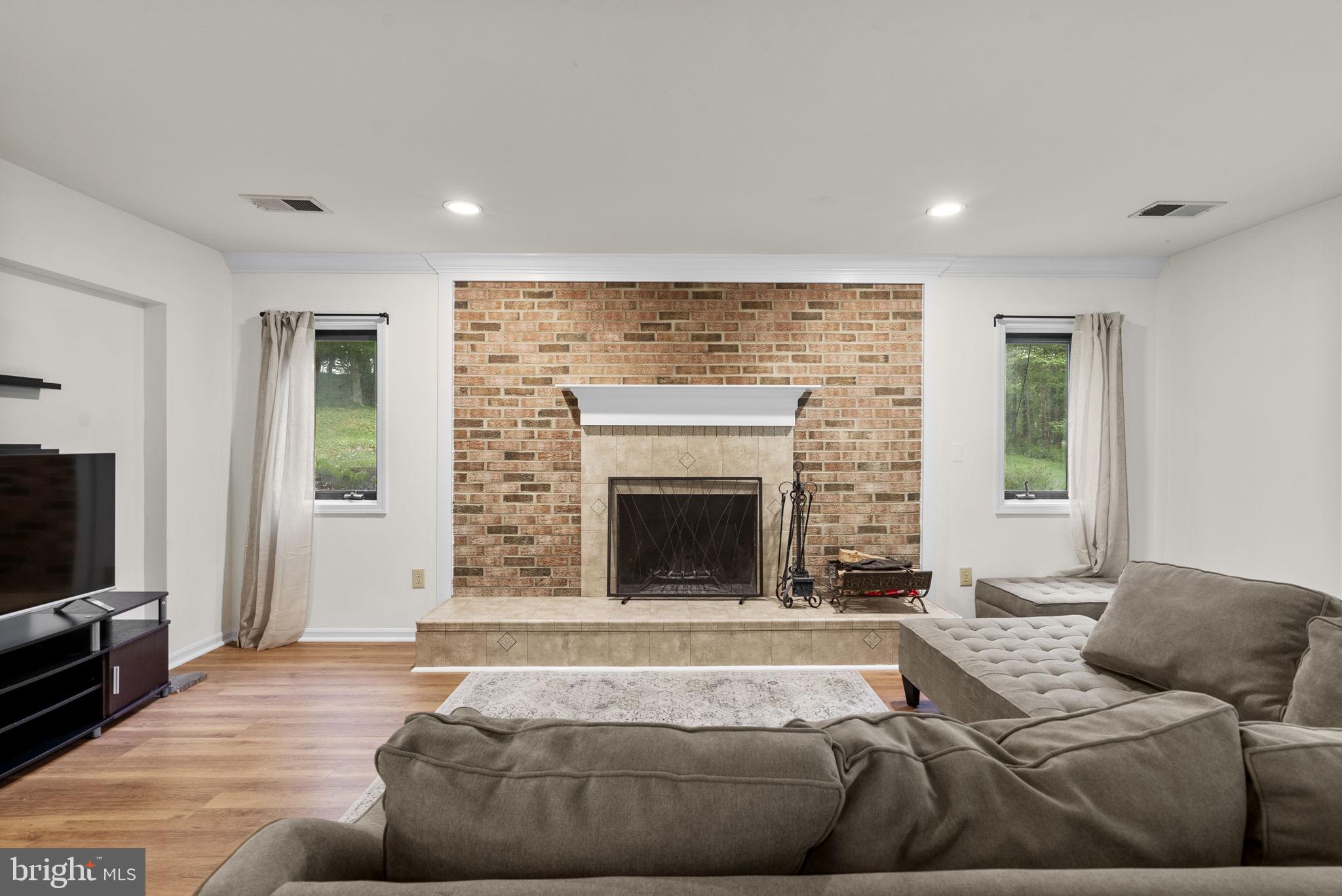 12410 Piedmont Road Clarksburg, MD 20871 - Photo 40 of 64 Cozy living space with brick fireplace.