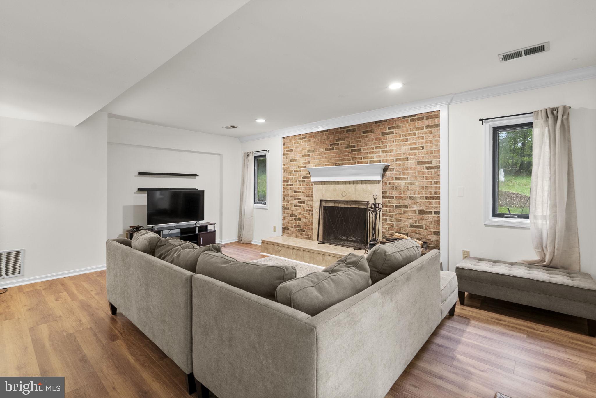 12410 Piedmont Road Clarksburg, MD 20871 - Photo 41 of 64 Cozy living space with a warm fireplace.