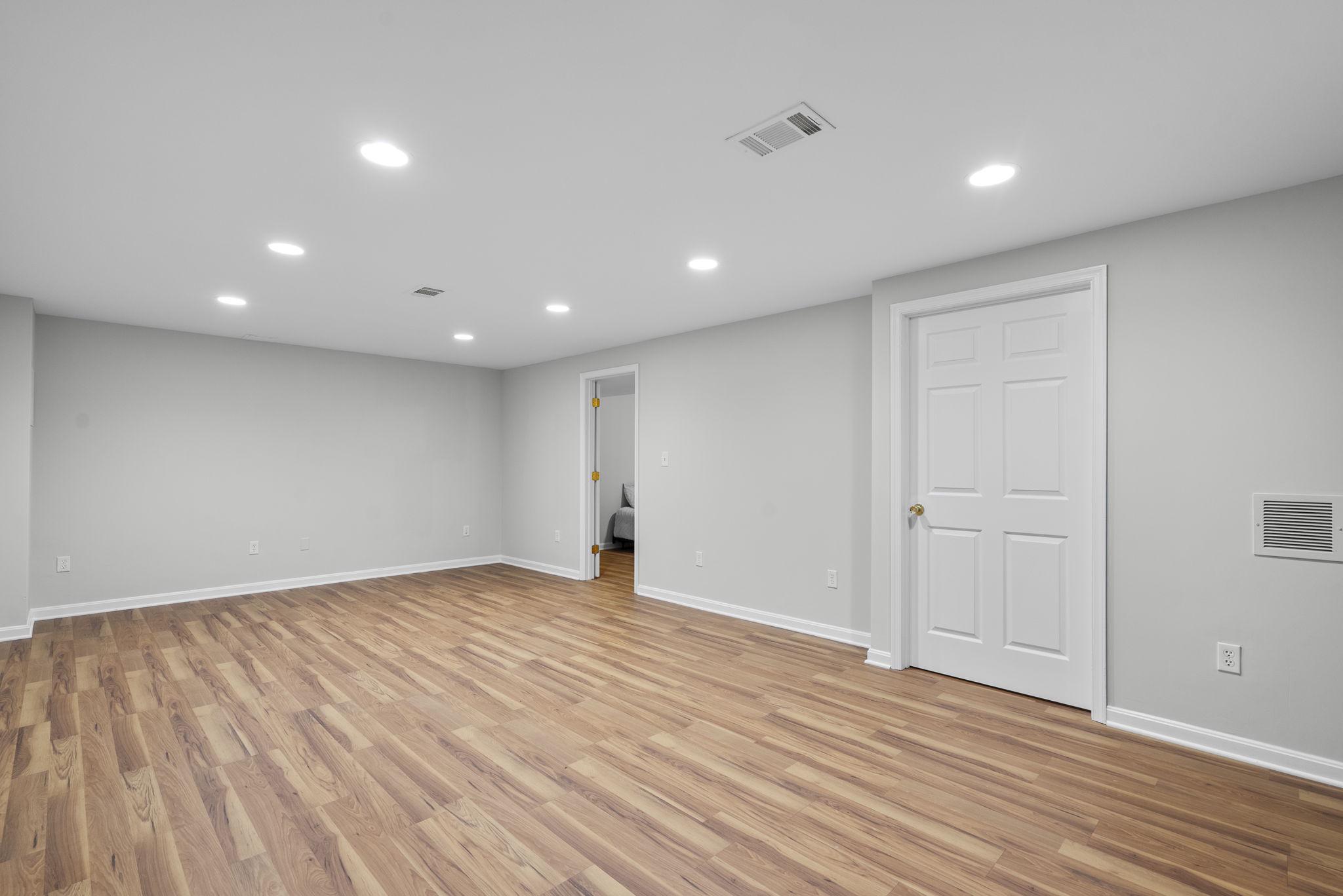 12410 Piedmont Road Clarksburg, MD 20871 - Photo 47 of 64 Fresh Luxury Vinyl Plank floor & recessed lights.