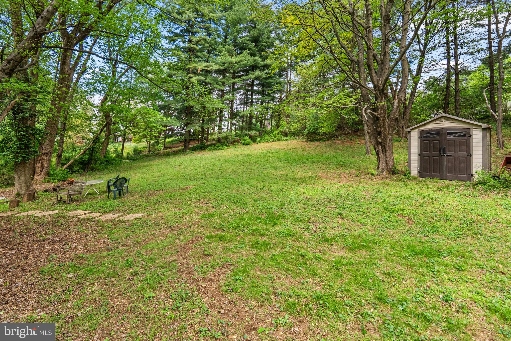 12410 Piedmont Road Clarksburg, MD 20871 - Photo 55 of 64 Serene backyard oasis with lush greenery.
