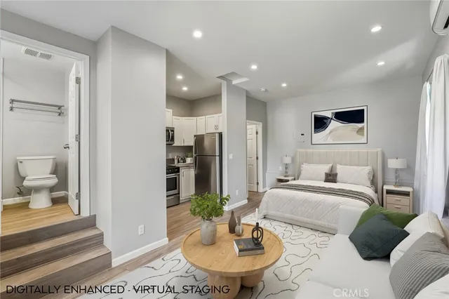 a living room with furniture and a mirror