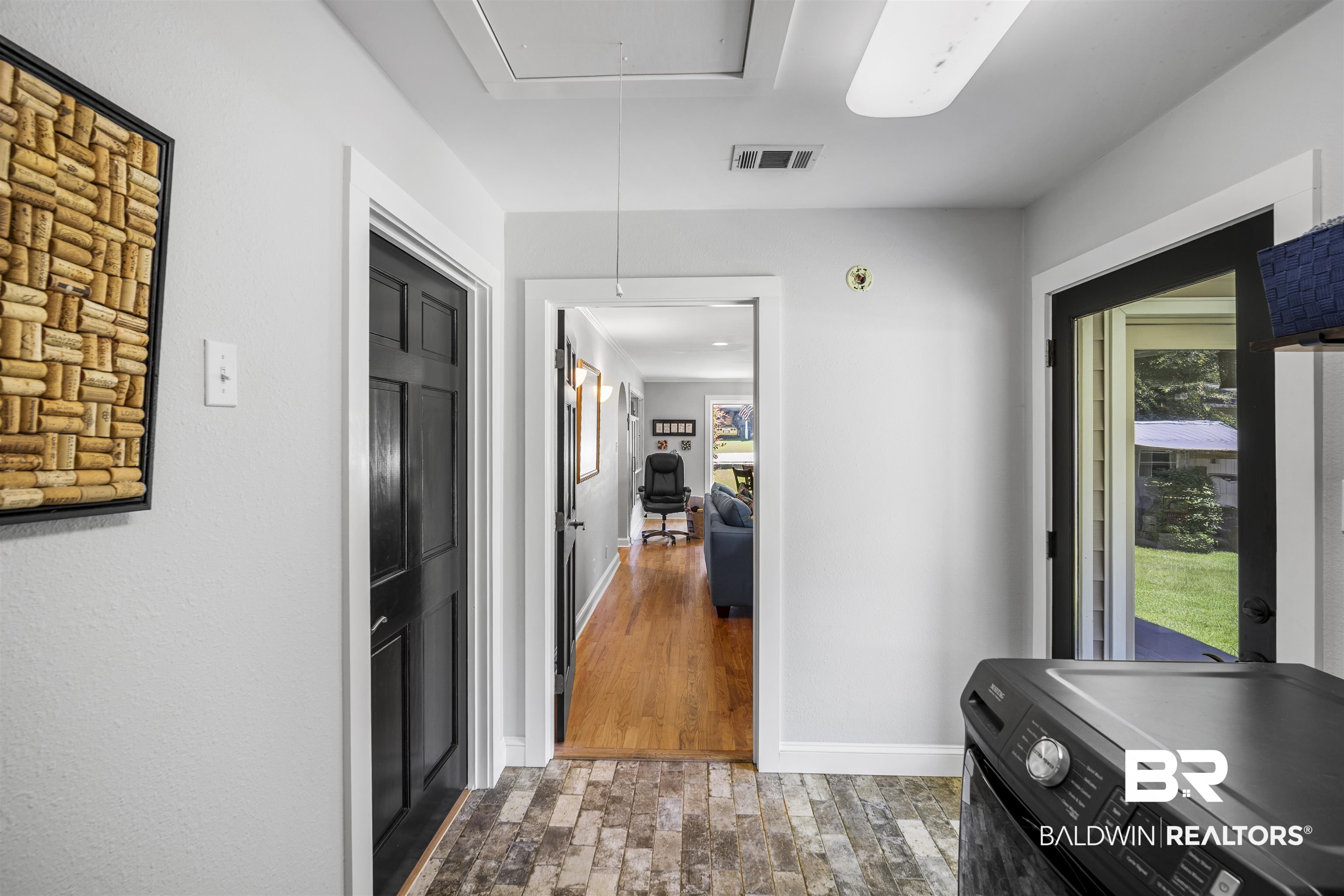 1615 5th Street Daphne, AL 36526 - Photo 23 of 28 Utility area featuring wood-finish tile flooring, light gray walls, and white trim