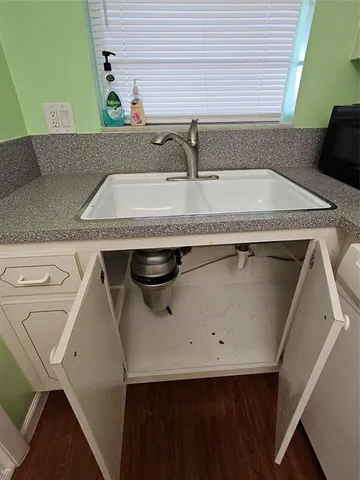 a stove top oven sitting inside of a kitchen