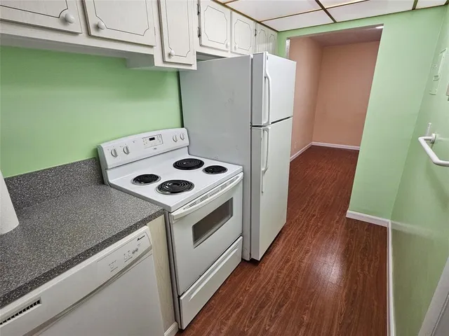 a view of room with window and wooden floor
