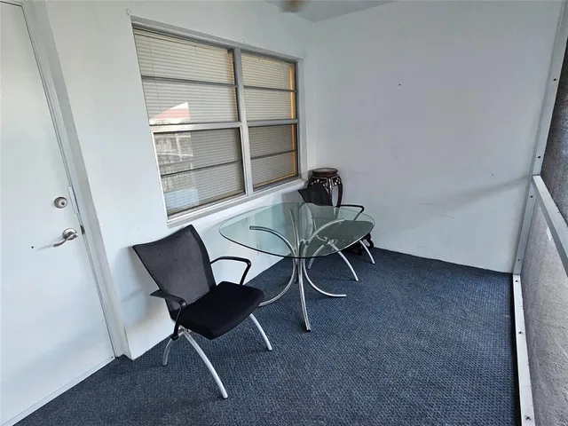 a workspace with furniture and a window