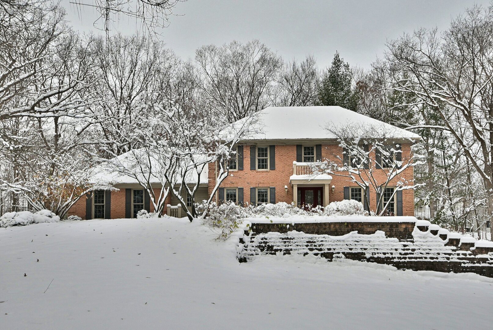 5N070 State Rte 31 St. Charles, IL 60175 - Photo 1 of 1 a front view of a house with a yard covered with snow