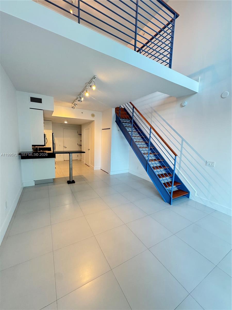 60 Southwest 13th Street, Unit 2606 Miami, FL 33130 - Photo 5 of 15 a view of a livingroom with furniture and furniture