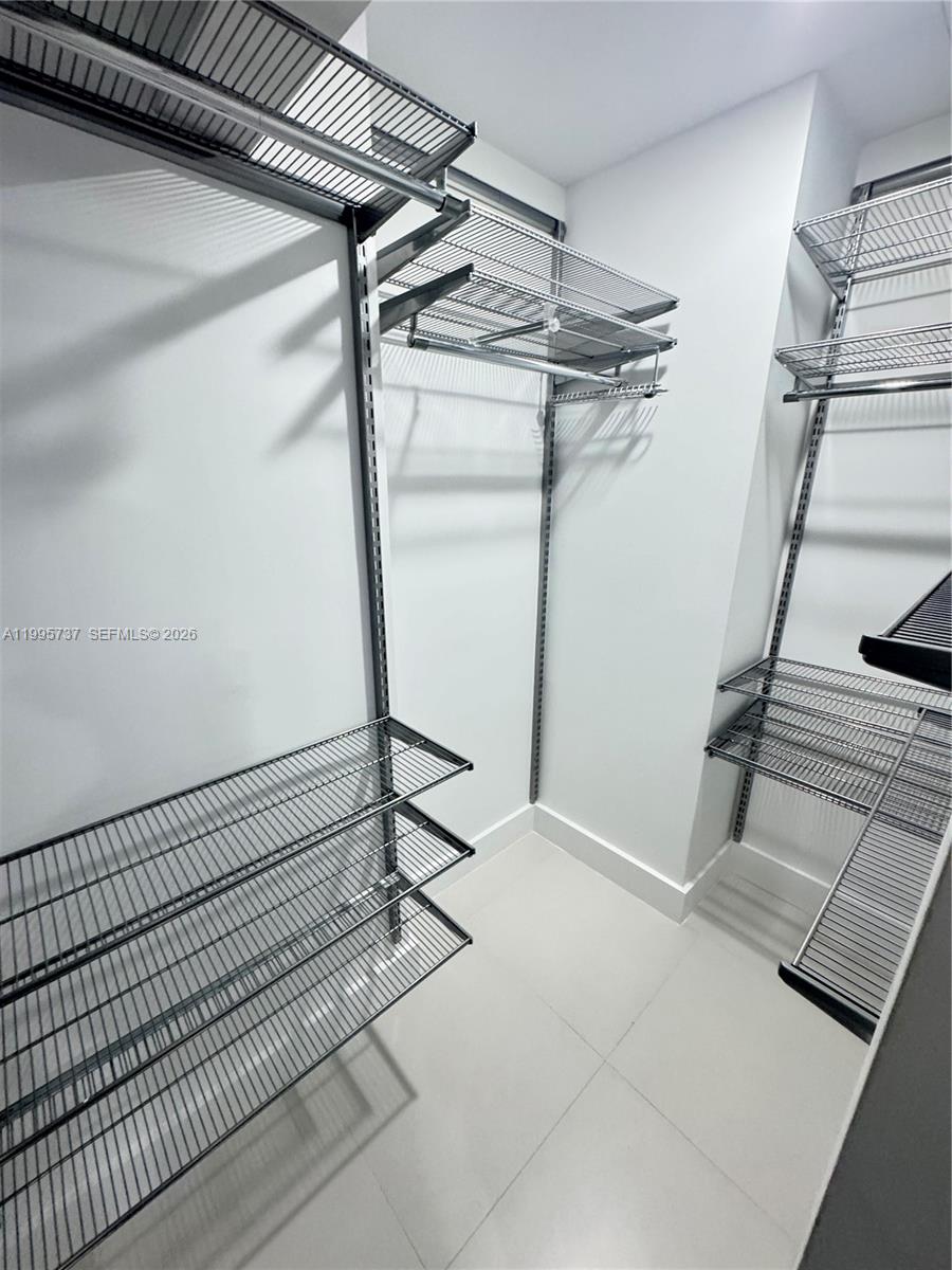 60 Southwest 13th Street, Unit 2606 Miami, FL 33130 - Photo 7 of 15 a view of a room with racks on the wall