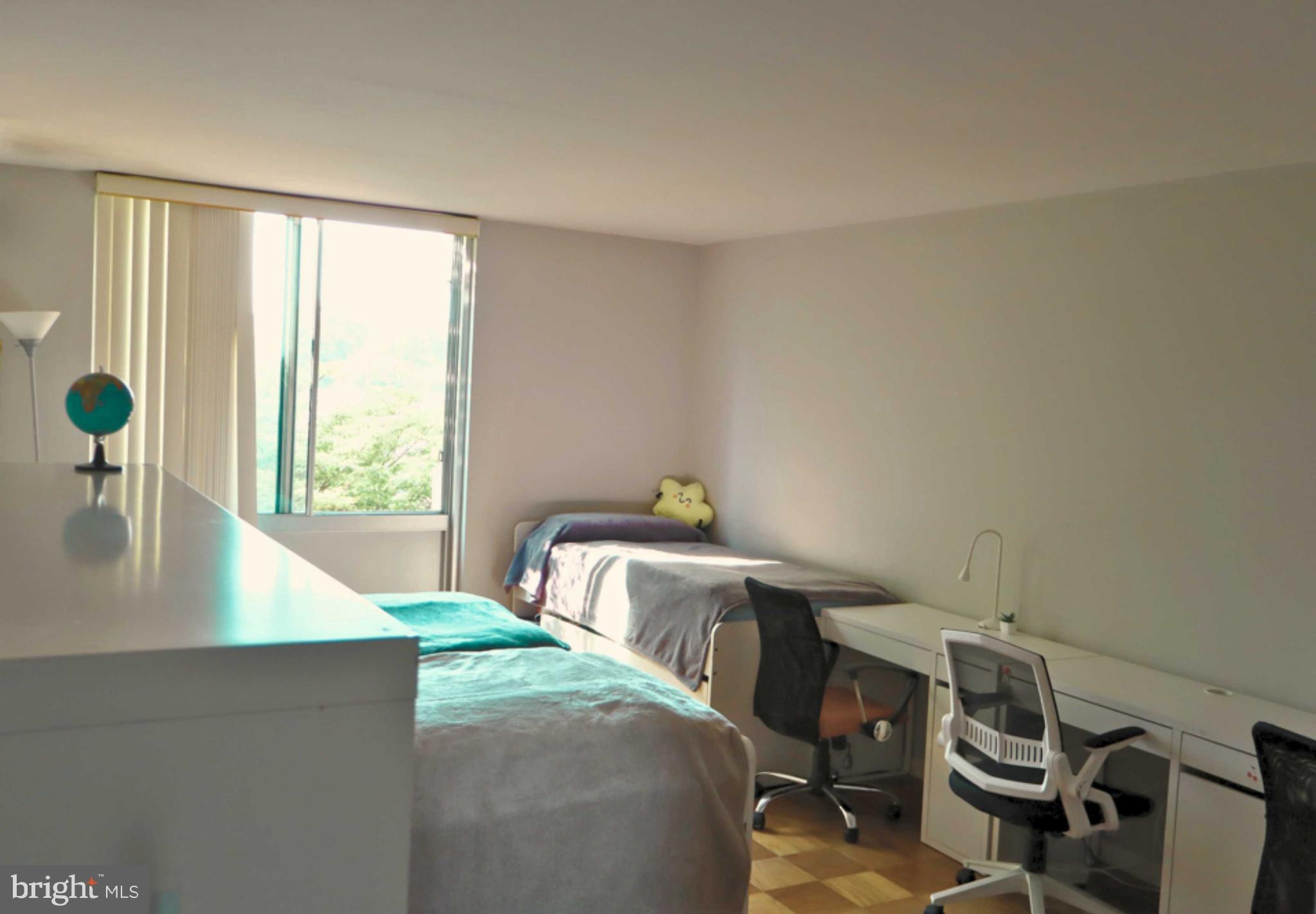 5101 River Road, Unit 405 Bethesda, MD 20816 - Photo 12 of 20 a living room with furniture and a window