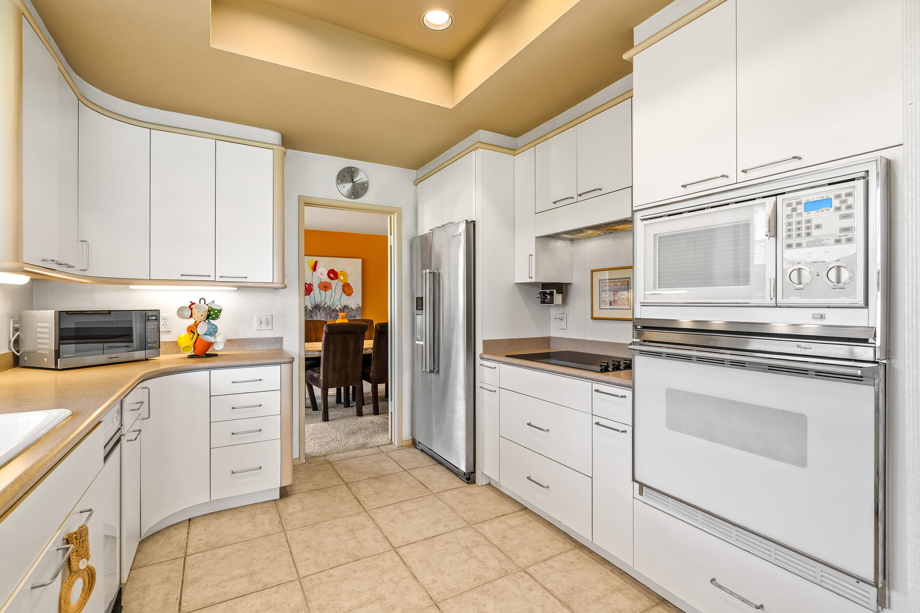 47 Columbia Drive Rancho Mirage, CA 92270 - Photo 16 of 59 a kitchen with granite countertop white cabinets and stainless steel appliances