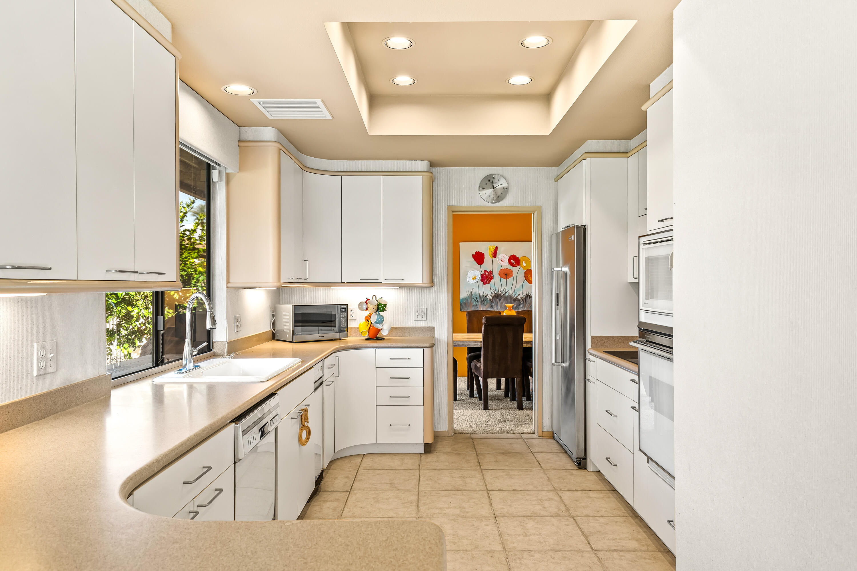 47 Columbia Drive Rancho Mirage, CA 92270 - Photo 17 of 59 a kitchen with stainless steel appliances granite countertop a sink and a refrigerator