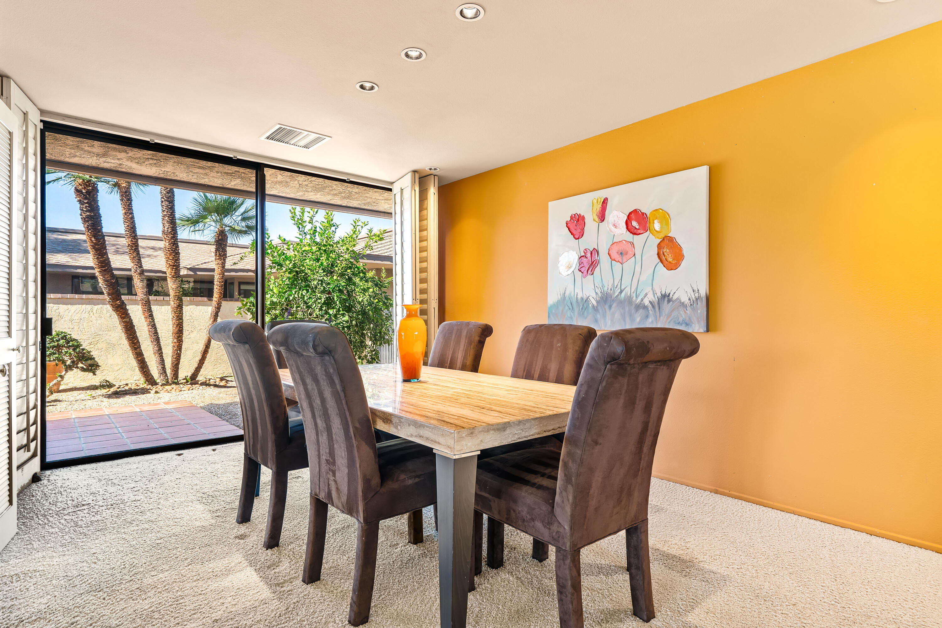 47 Columbia Drive Rancho Mirage, CA 92270 - Photo 18 of 59 a view of a dining room with furniture and a potted plant