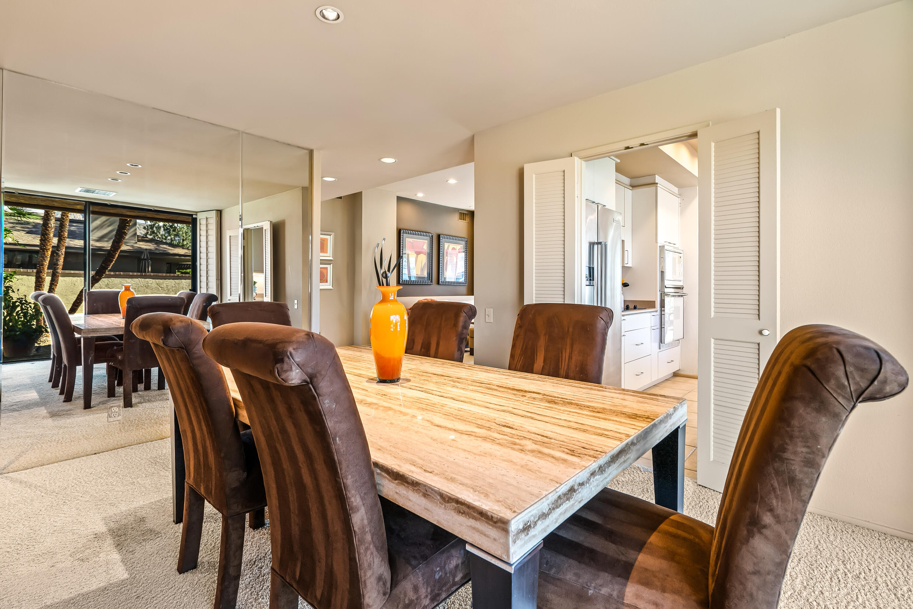 47 Columbia Drive Rancho Mirage, CA 92270 - Photo 19 of 59 a view of a dining room with furniture and window