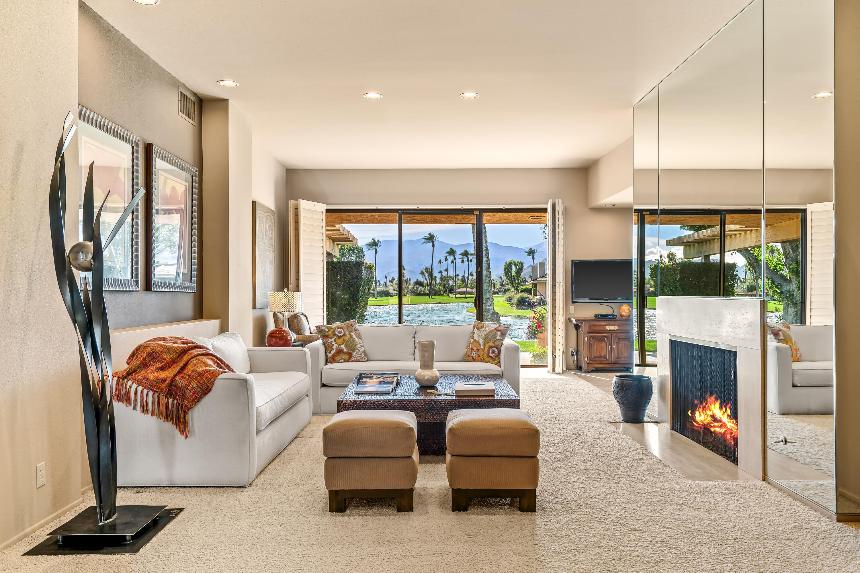 47 Columbia Drive Rancho Mirage, CA 92270 - Photo 2 of 59 a living room with fireplace furniture and a large window