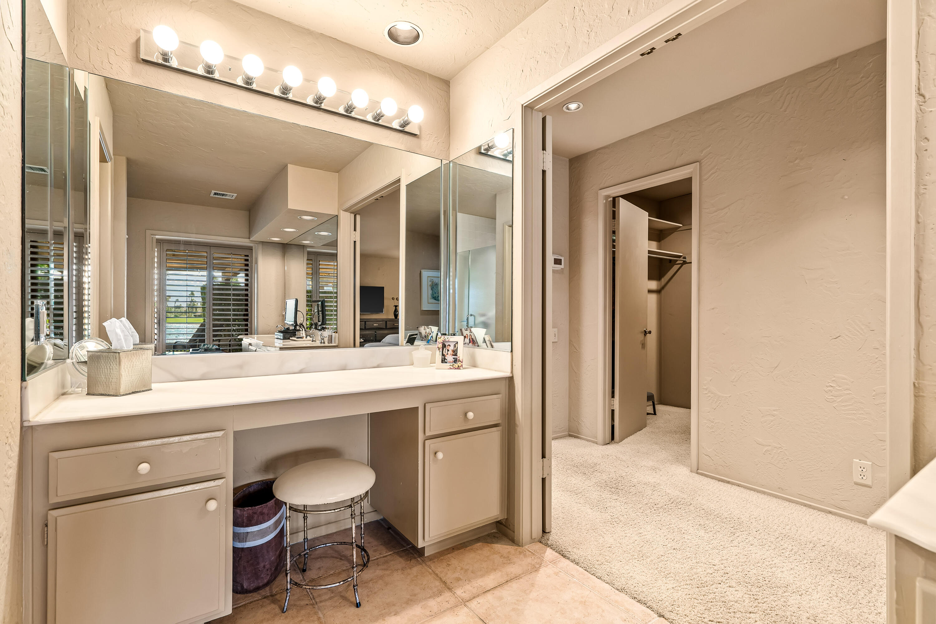 47 Columbia Drive Rancho Mirage, CA 92270 - Photo 26 of 59 a spacious bathroom with a granite countertop sink a toilet and a mirror