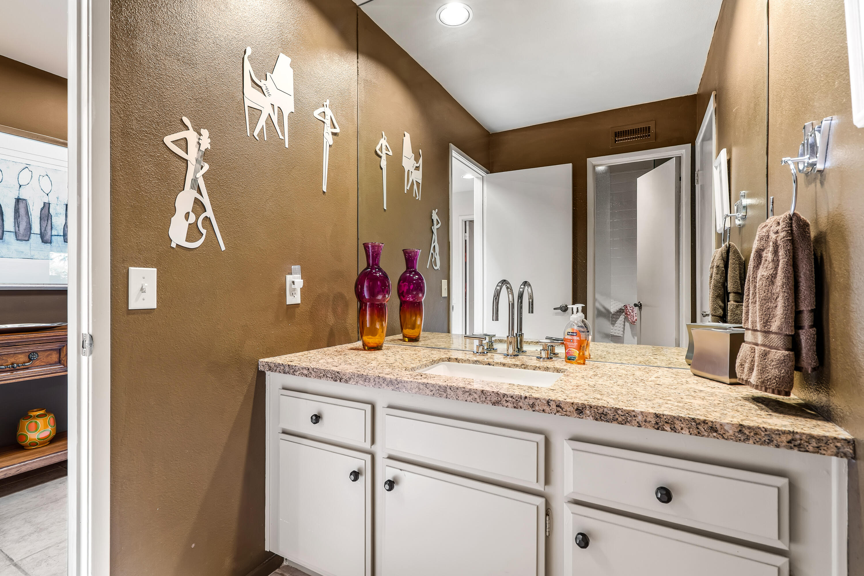 47 Columbia Drive Rancho Mirage, CA 92270 - Photo 40 of 59 a bathroom with a granite countertop double vanity sink and a mirror