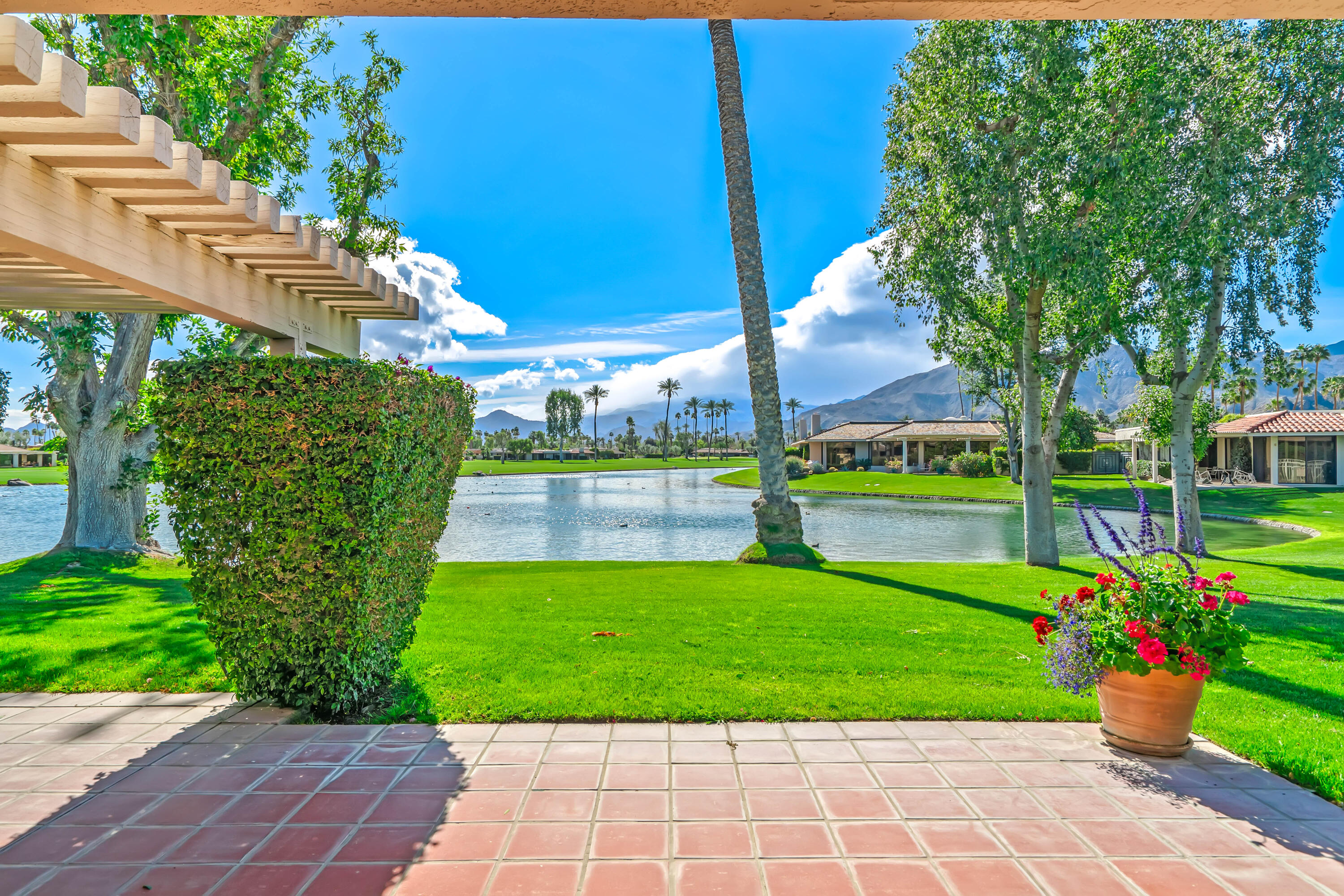 47 Columbia Drive Rancho Mirage, CA 92270 - Photo 43 of 59 a view of a park with plants and large trees