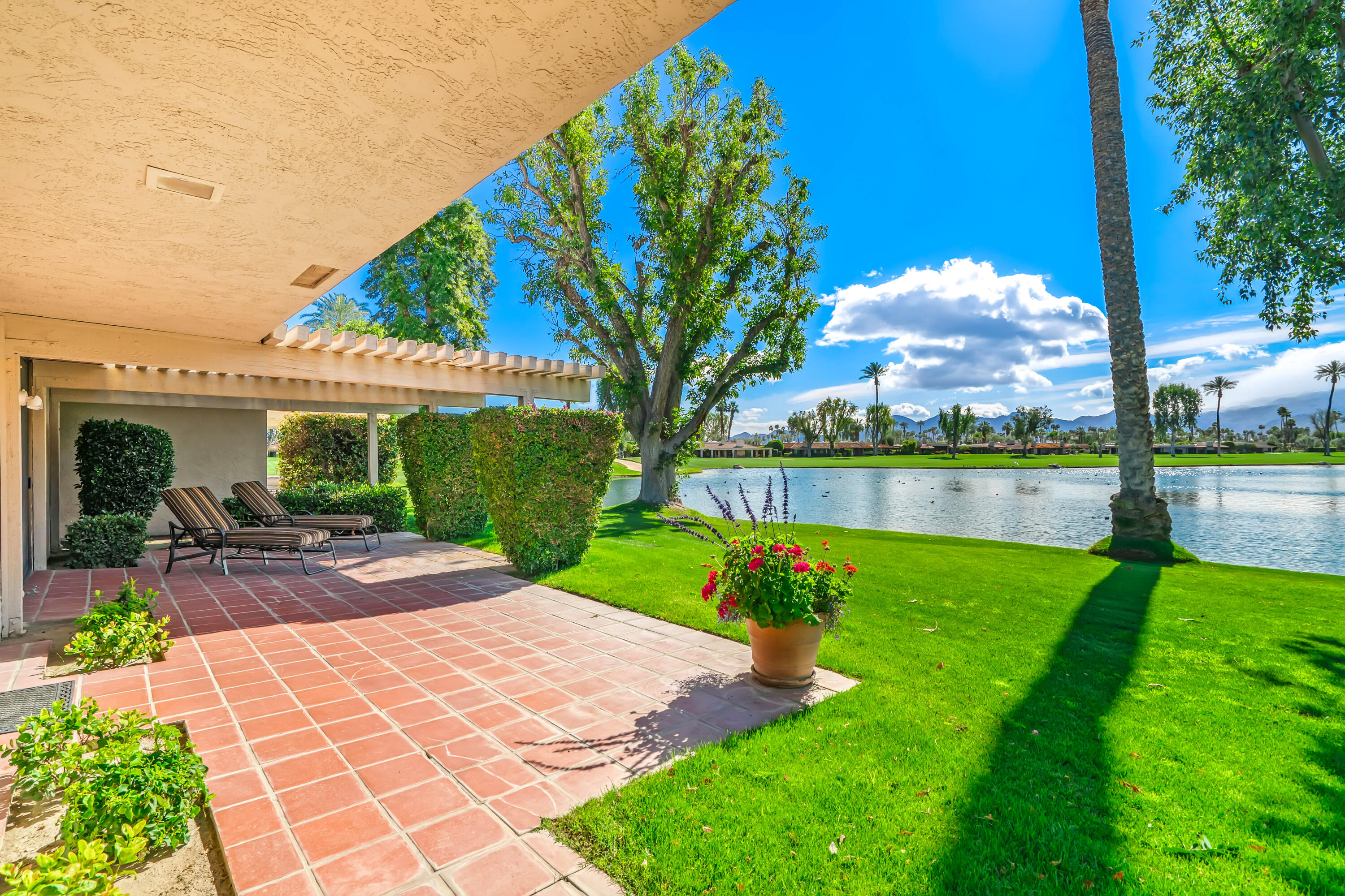 47 Columbia Drive Rancho Mirage, CA 92270 - Photo 44 of 59 a view of a house with garden and a patio