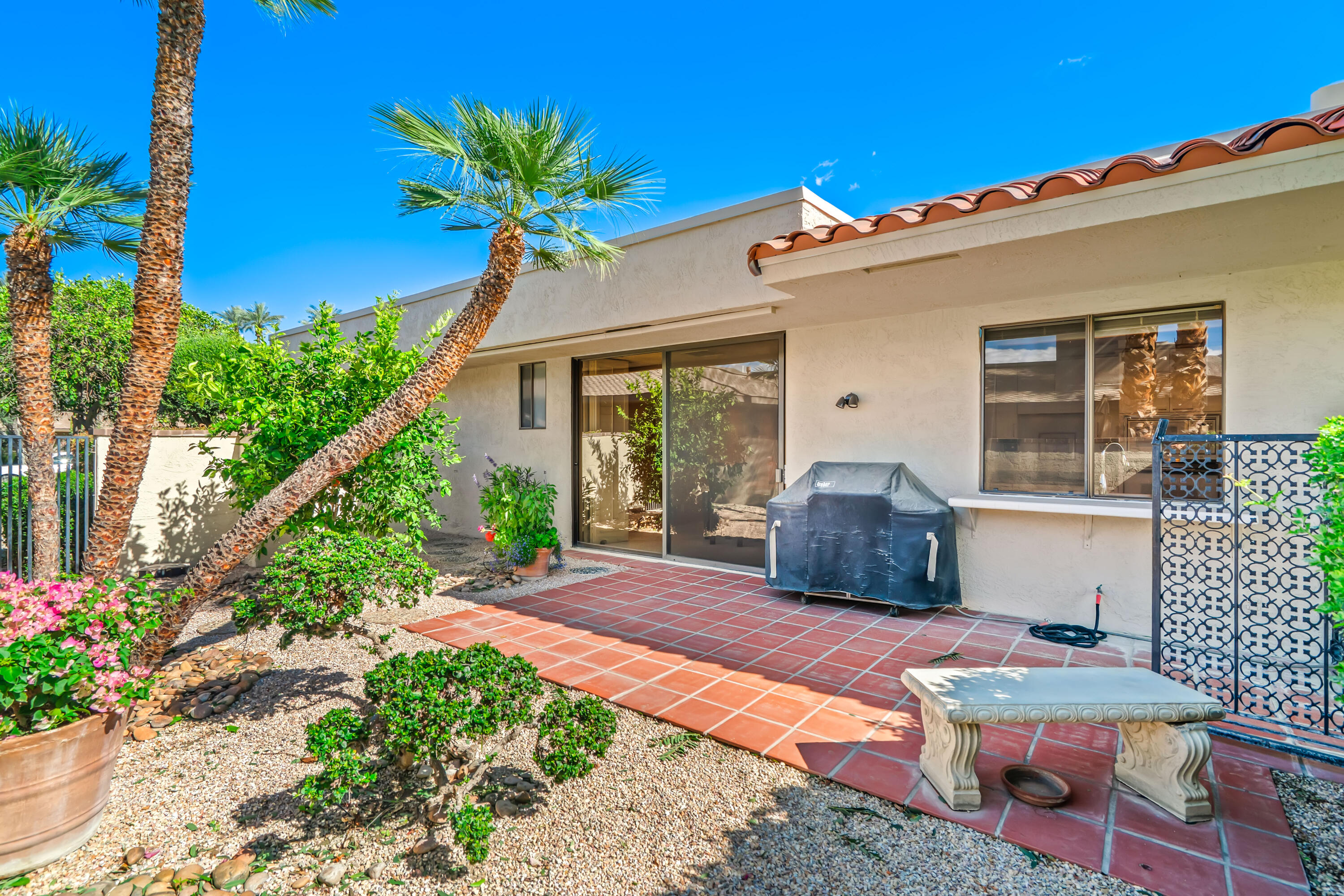 47 Columbia Drive Rancho Mirage, CA 92270 - Photo 51 of 59 a front view of a house with a yard