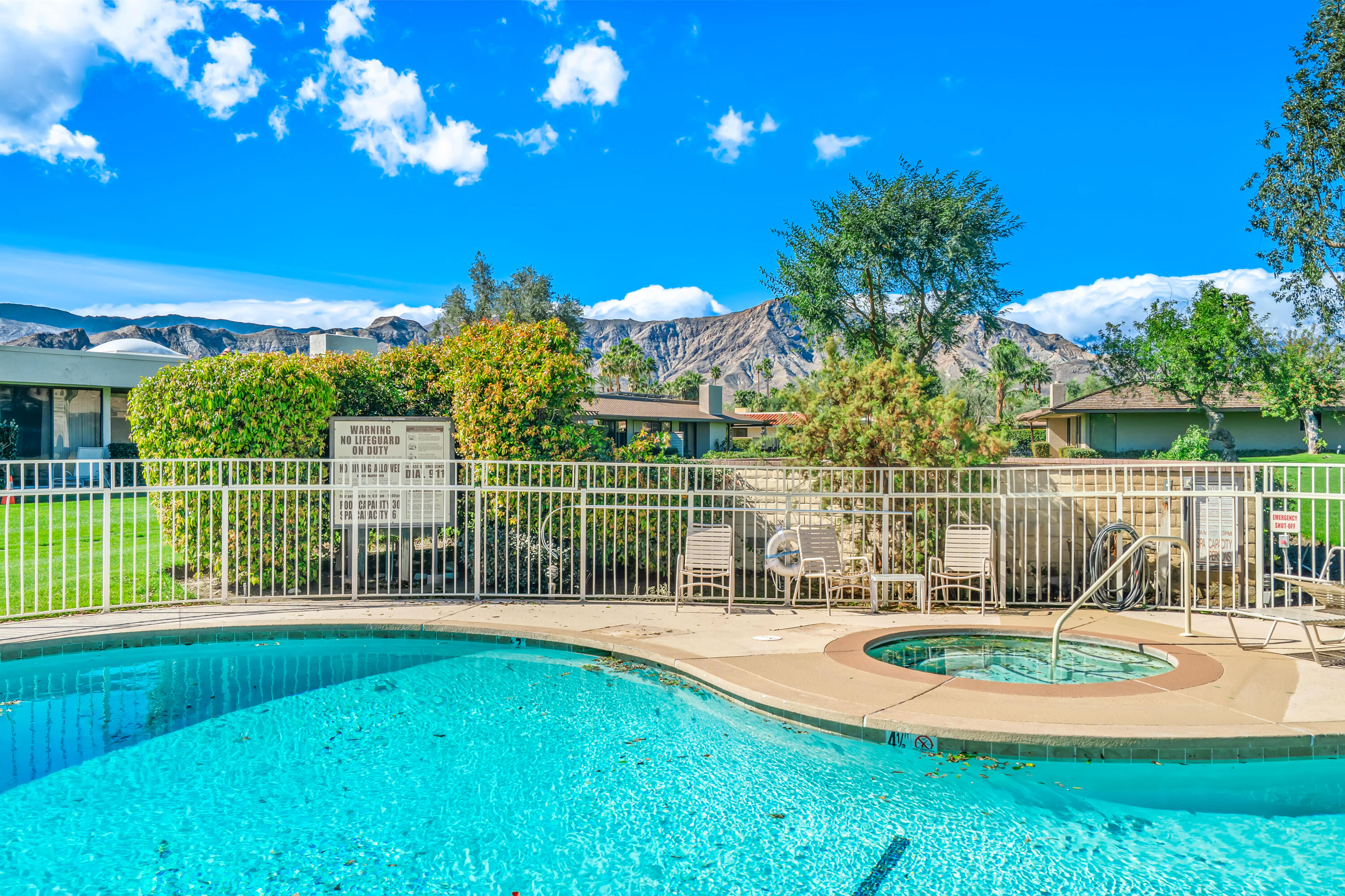 47 Columbia Drive Rancho Mirage, CA 92270 - Photo 59 of 59 a view of a swimming pool with a patio