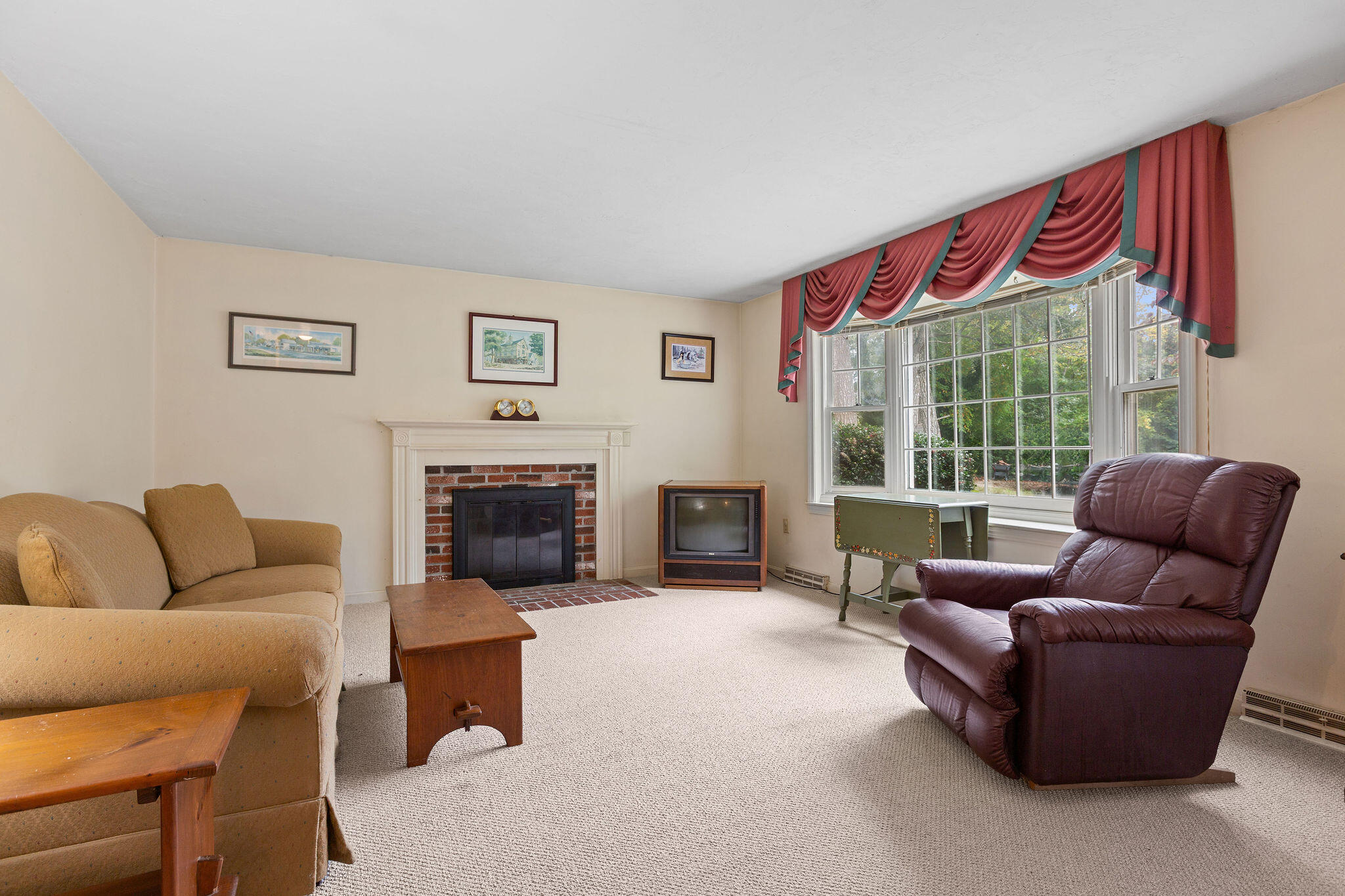 11 Windjammer Road Harwich, MA 02645 - Photo 11 of 29 a living room with furniture a large window and a fireplace