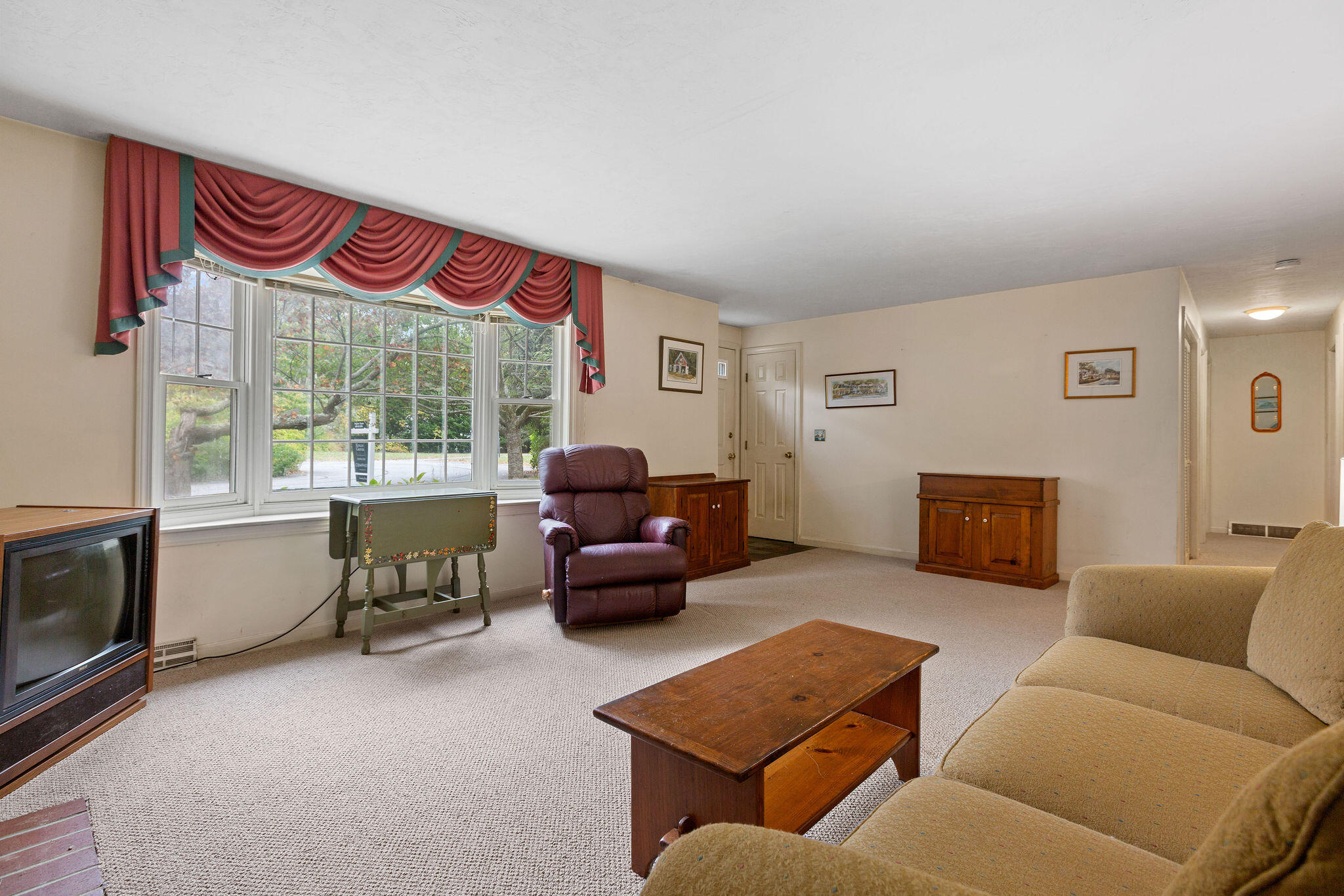 11 Windjammer Road Harwich, MA 02645 - Photo 12 of 29 a living room with furniture and a fireplace