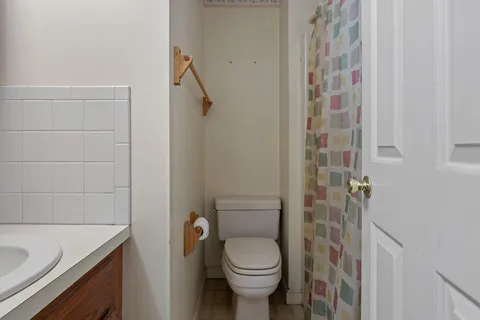 a dining room with furniture a chandelier and wooden floor