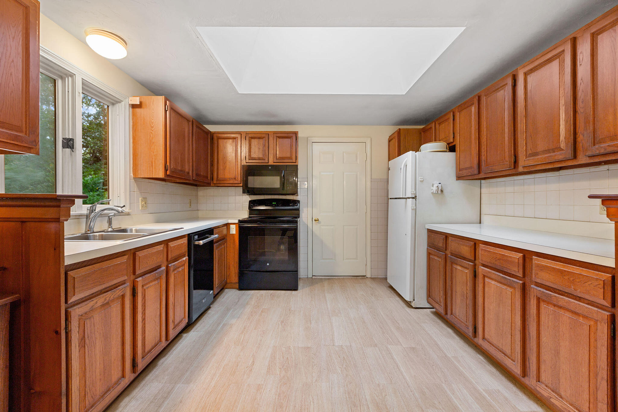 11 Windjammer Road Harwich, MA 02645 - Photo 17 of 29 a kitchen with stainless steel appliances a refrigerator sink and cabinets