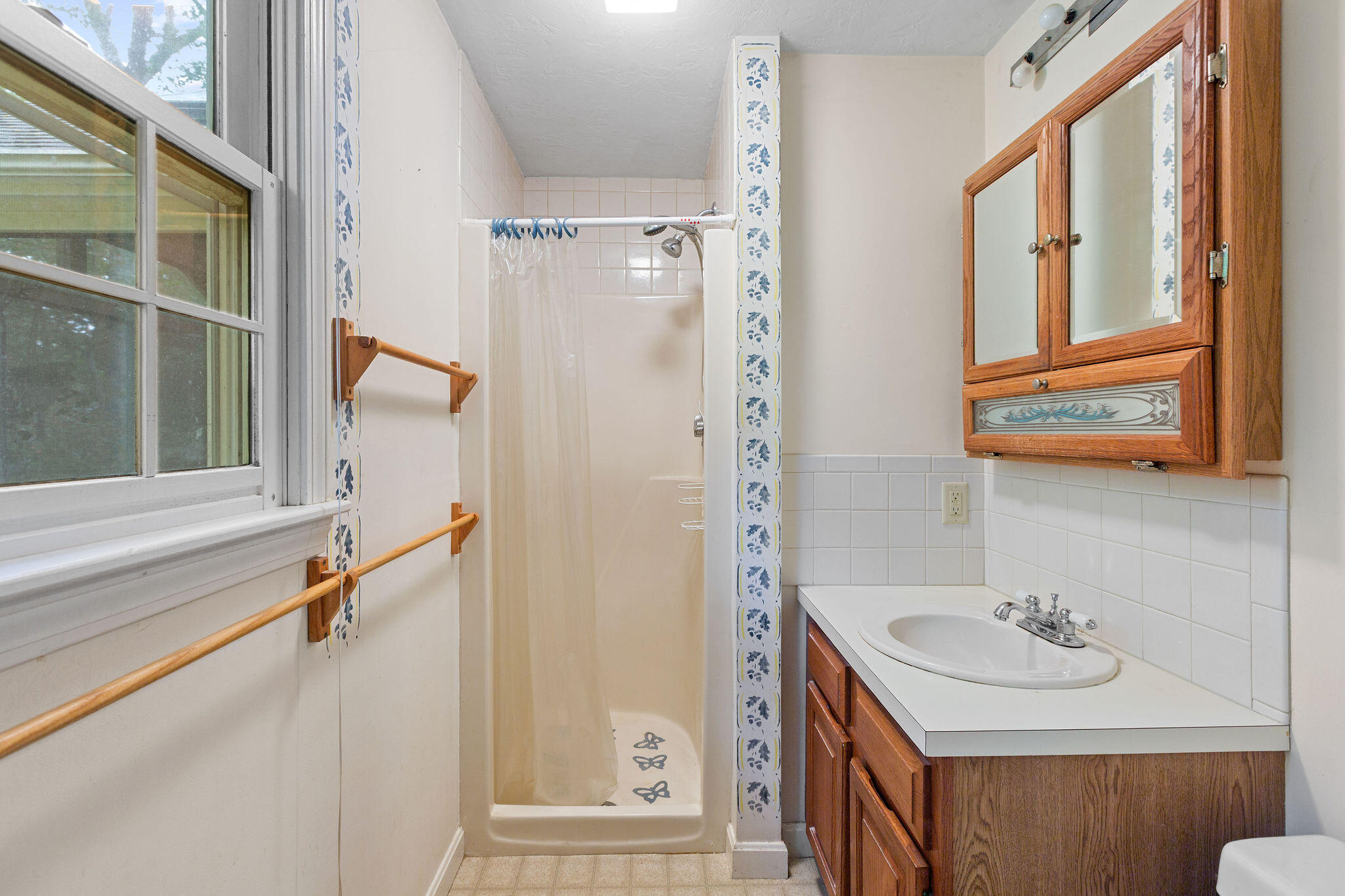 11 Windjammer Road Harwich, MA 02645 - Photo 26 of 29 a bathroom with a sink a mirror and a shower