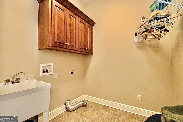 a spacious bathroom with a double vanity sink a mirror and a shower