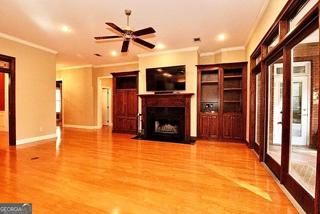 a kitchen with granite countertop wooden cabinets and a stove top oven