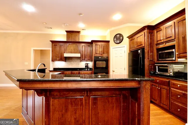 a view of a livingroom with furniture and wooden floor