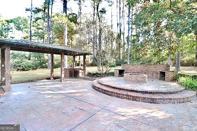 a view of a house with a yard covered in snow