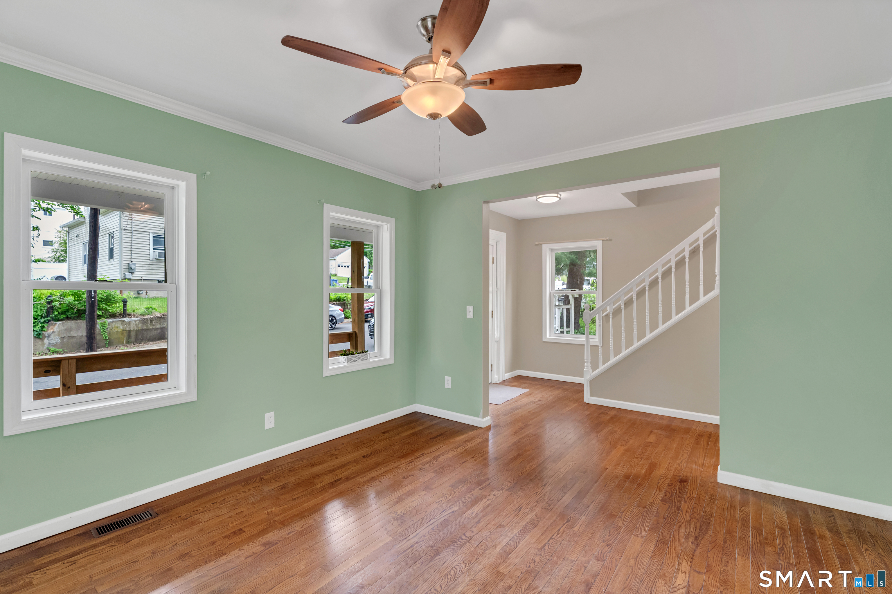 75 Summit Street Norwich, CT 06360 - Photo 12 of 40 a view of an empty room with wooden floor and a window